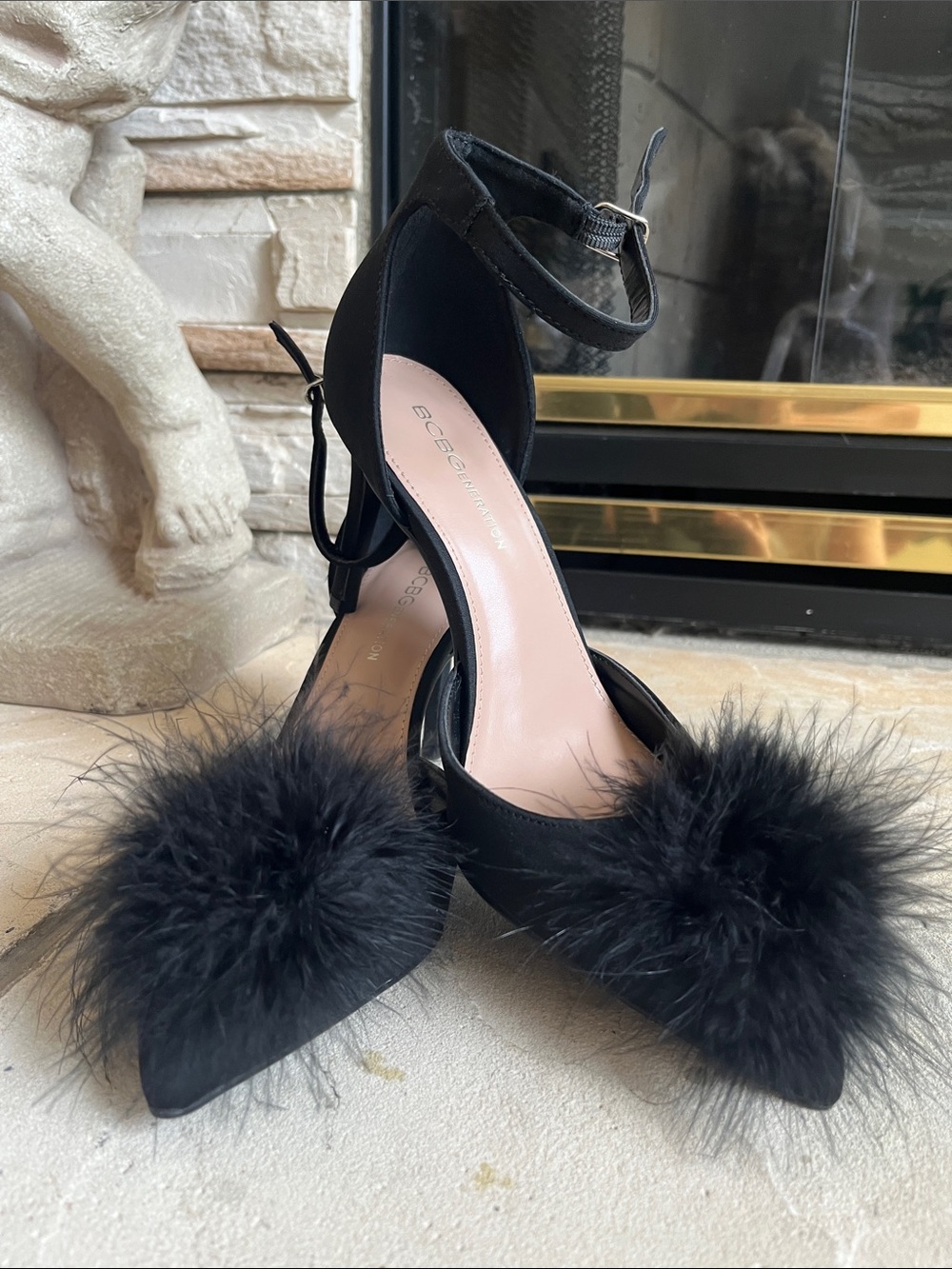 BCBGeneration Black Pointed-Toe Ankle-Strap Heels with Pom Pom